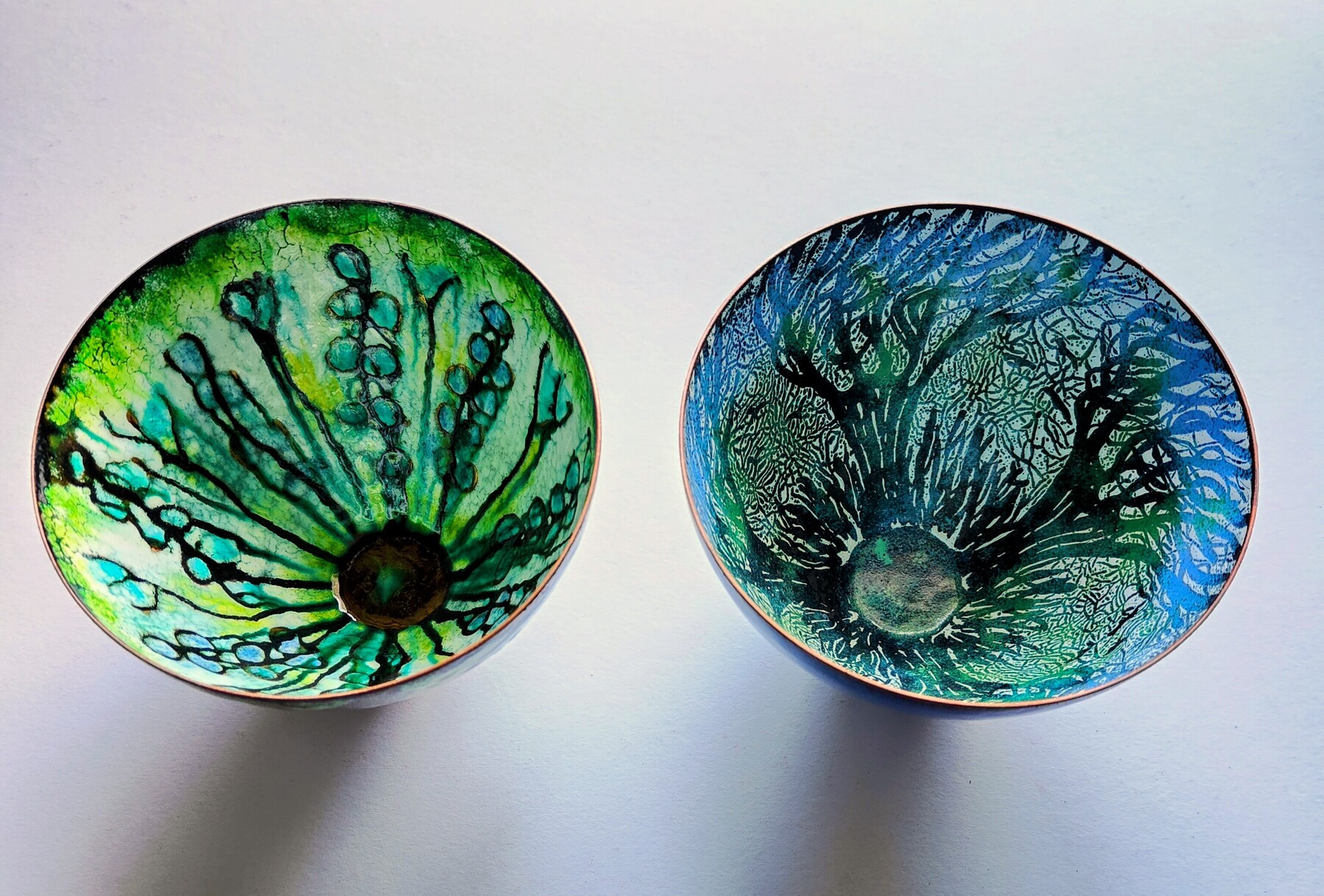 Tha same bowls but different decorative methods.