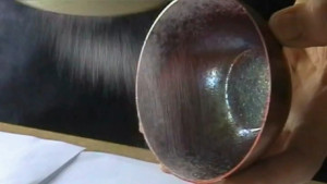 Enamelling curved surfaces